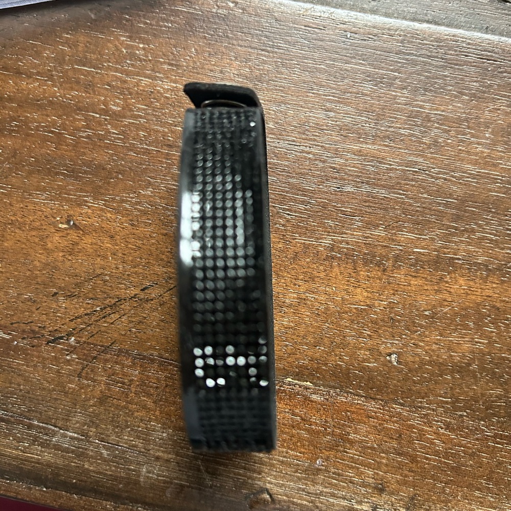 Black fashion bracelet. Button closure. Never worn